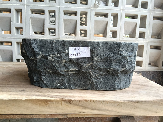 Front view of 6A33-4133 andesite stone vessel — polished interior bowl