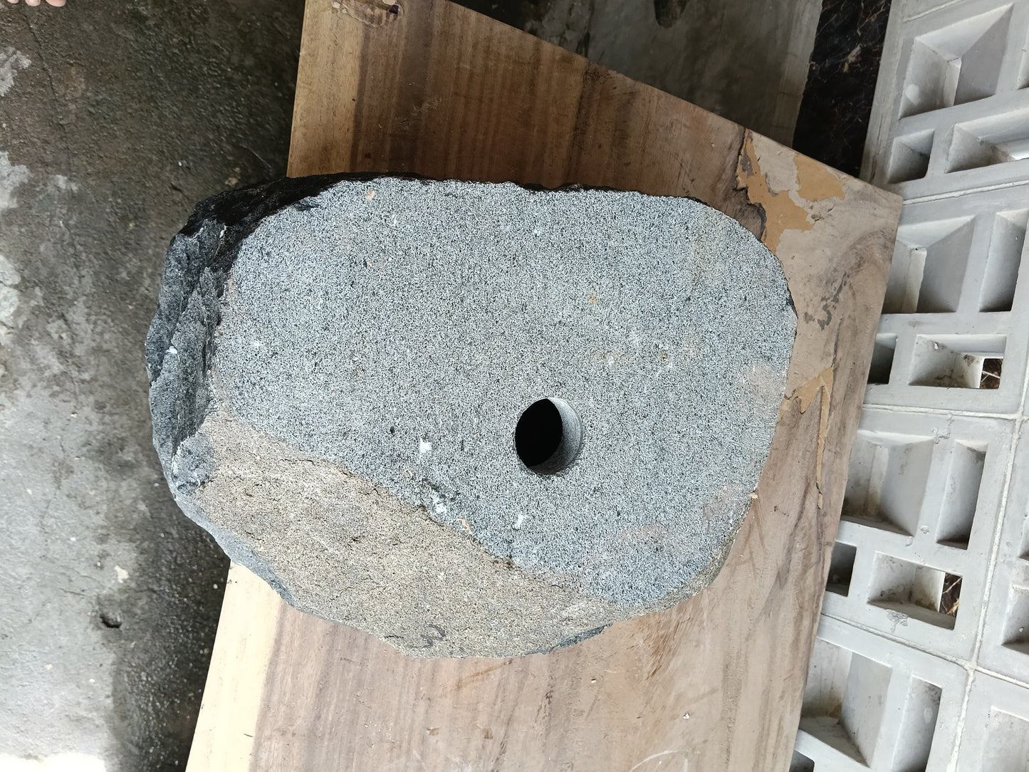 Bottom view of 6A33-4133 solid andesite stone sink — standard drain hole
