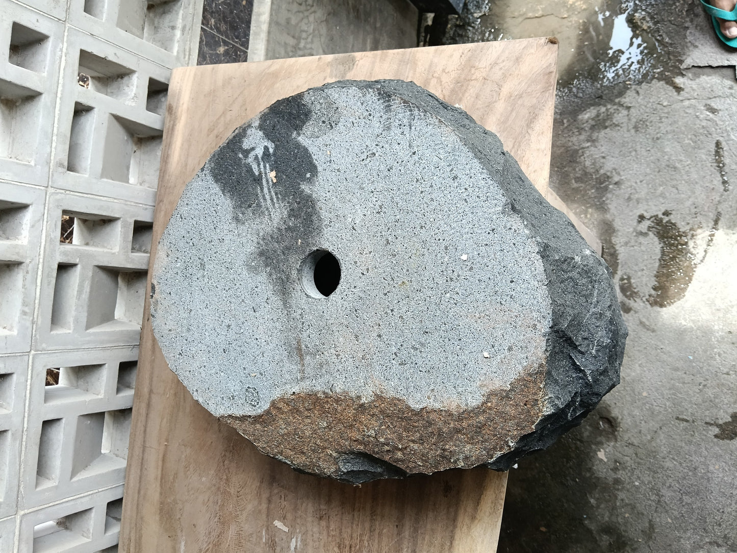 Bottom view of 6A34-5142 solid andesite stone sink — standard drain hole