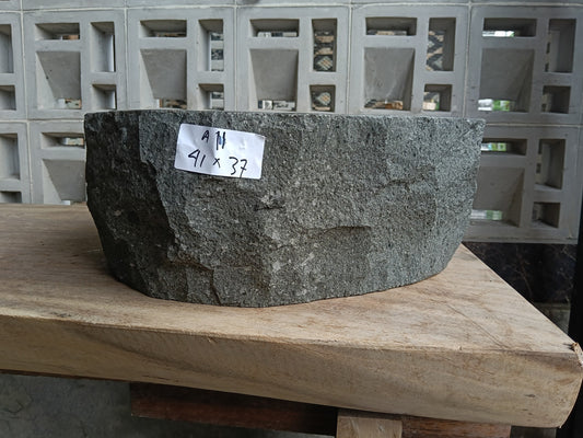 Front view of 6A11-4137 andesite stone vessel — polished interior bowl