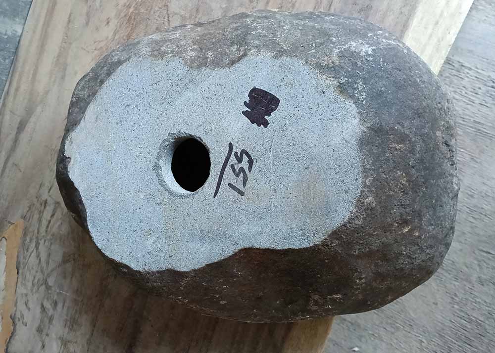 Bottom view showing raw natural stone base of the handcrafted oval river stone sink SKU 6551-4032