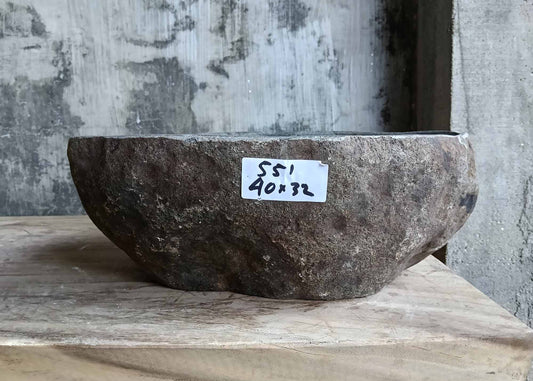 Front view showing natural rugged brown stone texture on the exterior of the river stone sink SKU 6551-4032