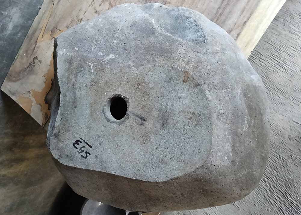 Bottom view of river stone sink with central drain opening – 6553-4943