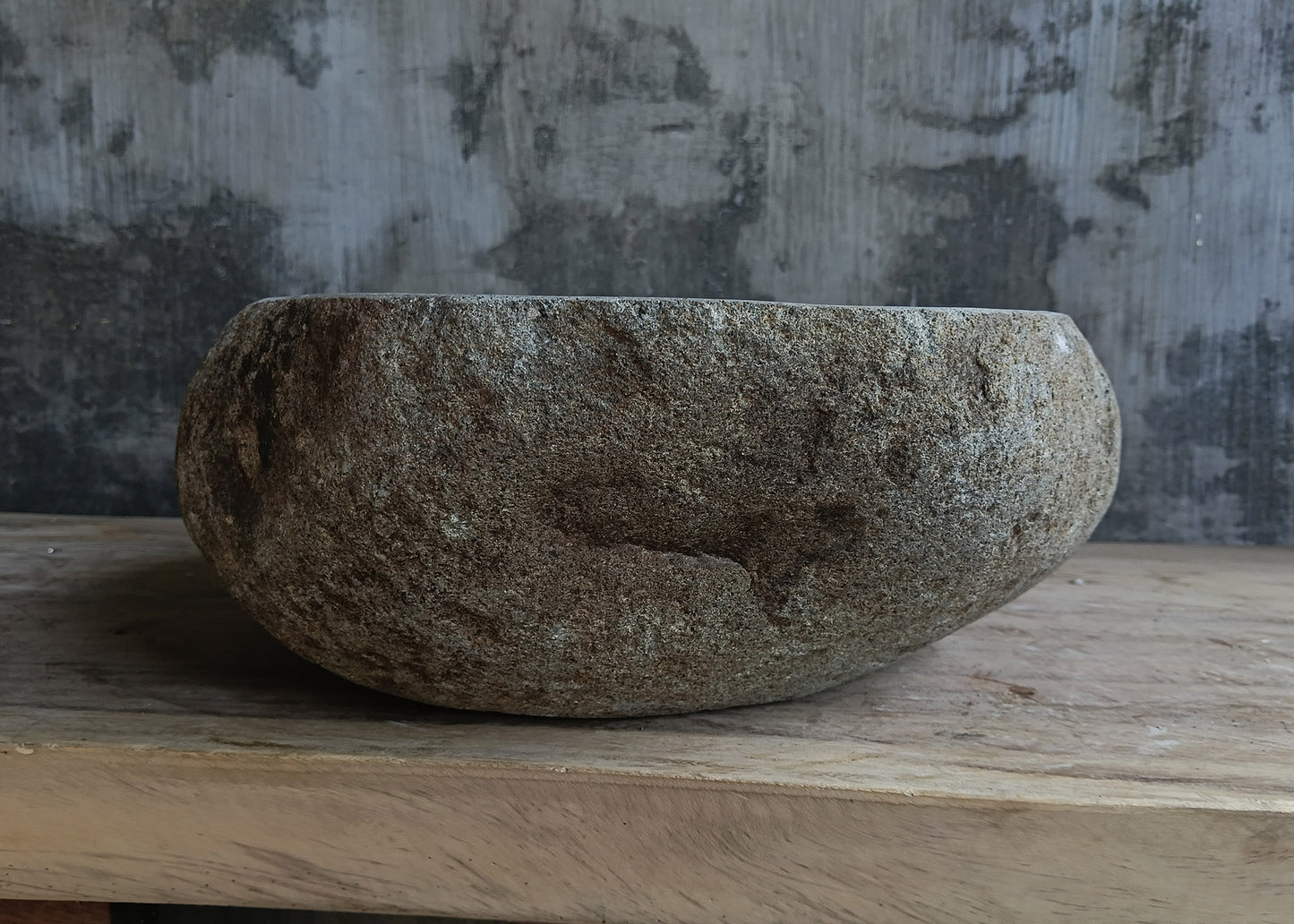 Left side view of oval light gray river stone sink 6641-4837 with rough exterior