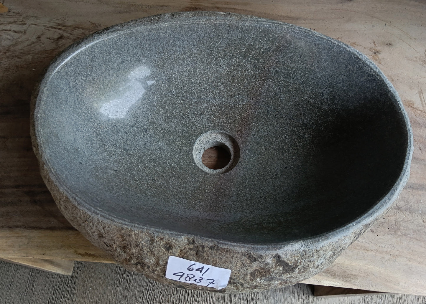 Top view of oval light gray river stone sink 6641-4837 with polished interior