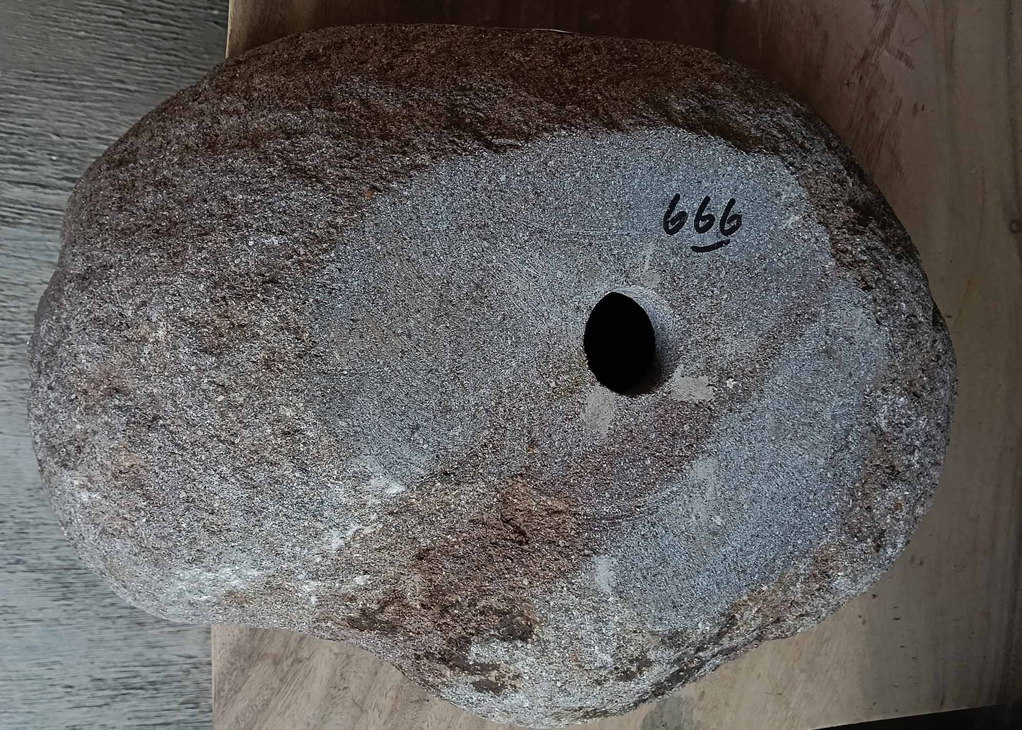 Bottom view of handcrafted oval dark gray river stone sink 6666-4835