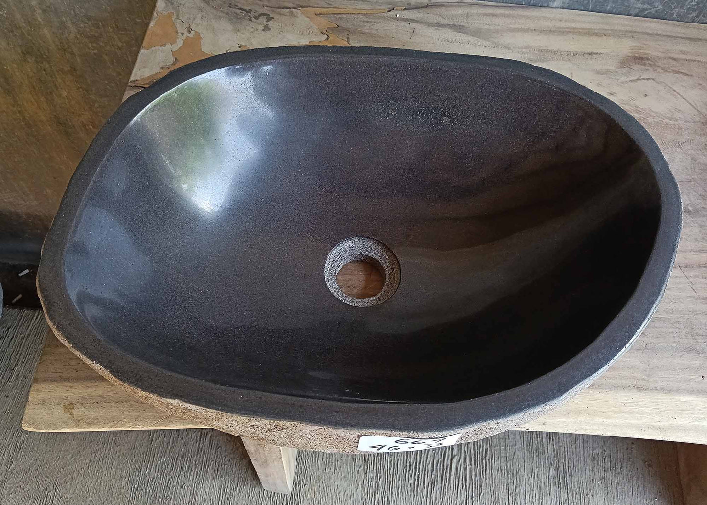 Top view of oval dark gray river stone sink 6667-4633 with polished interior