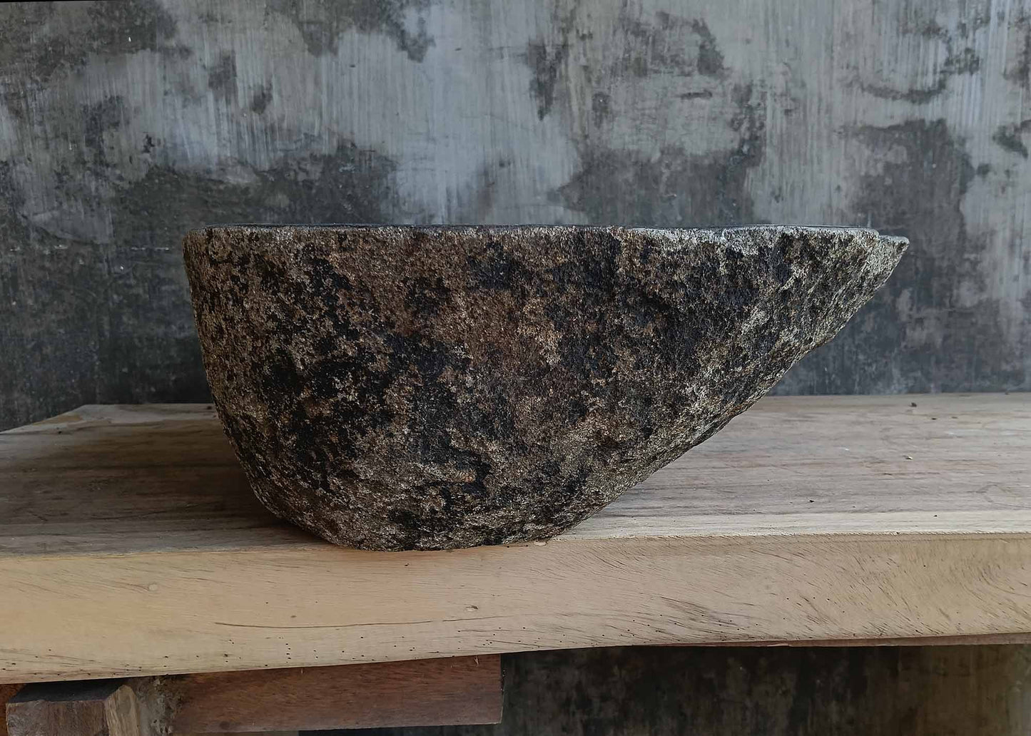 Left side view of river stone sink 6673-1515 highlighting rugged textured exterior