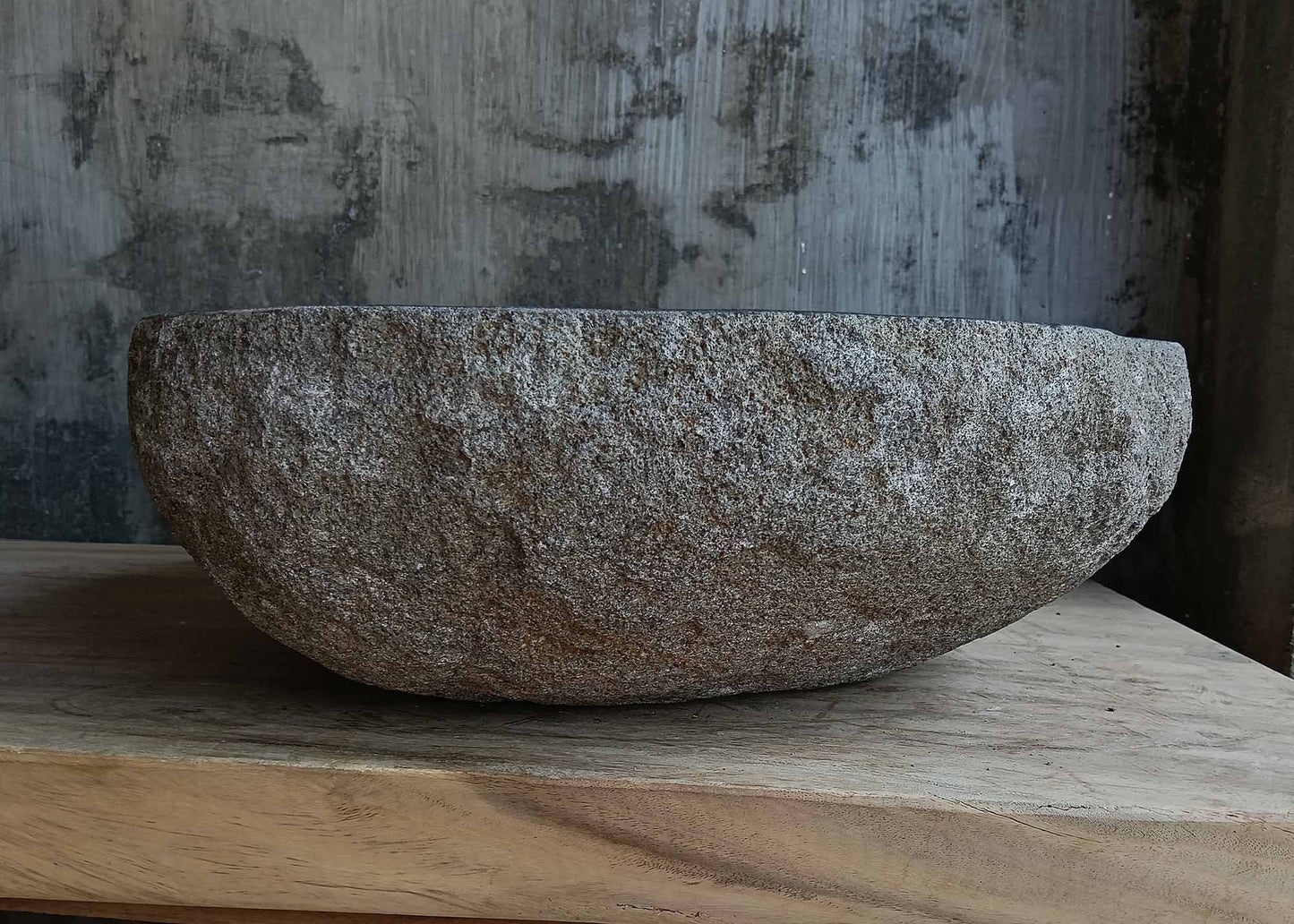 Left side view of dark gray river stone sink 6674-4542 with natural rough exterior