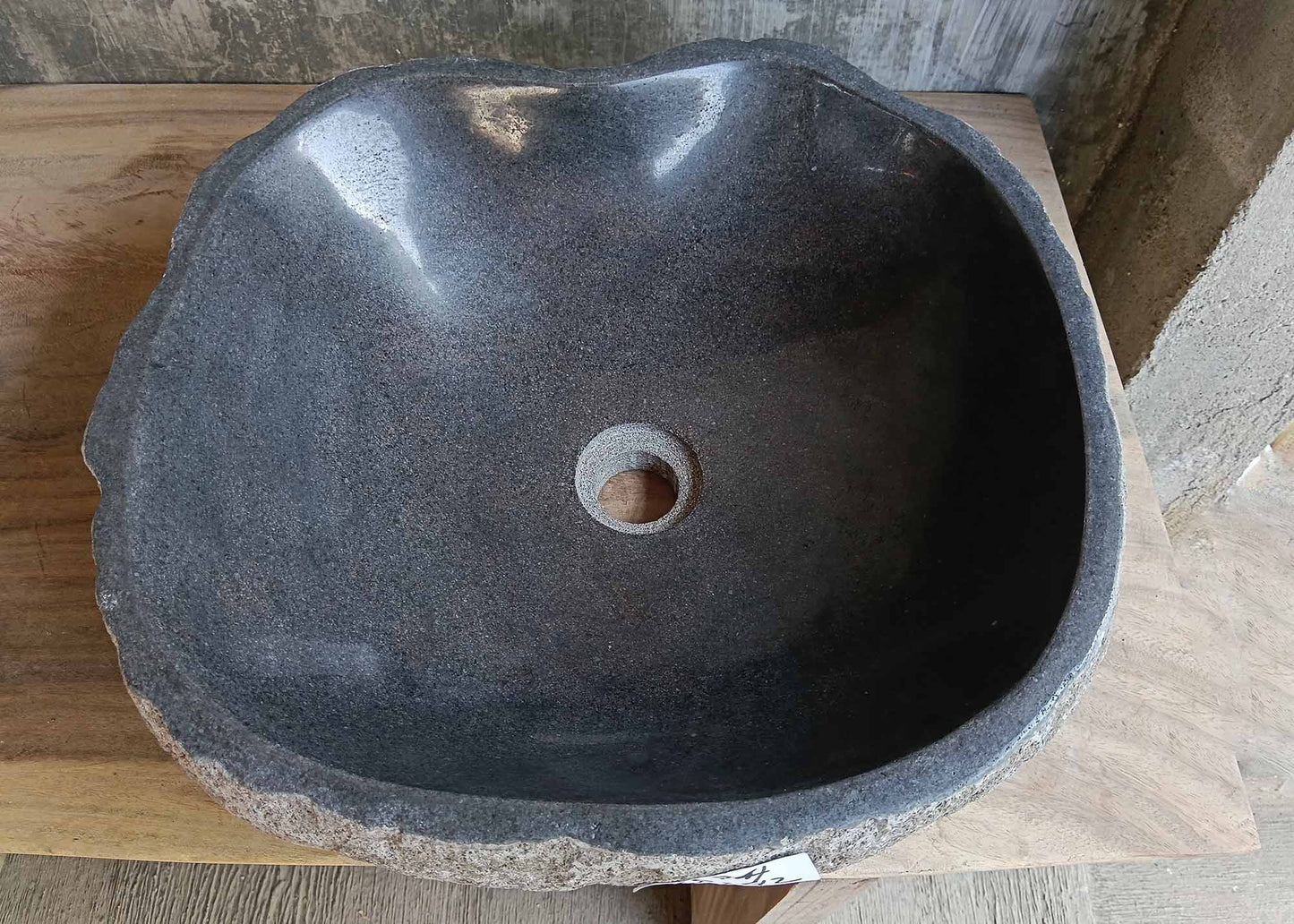Top view of handcrafted dark gray river stone sink 6674-4542 with polished interior