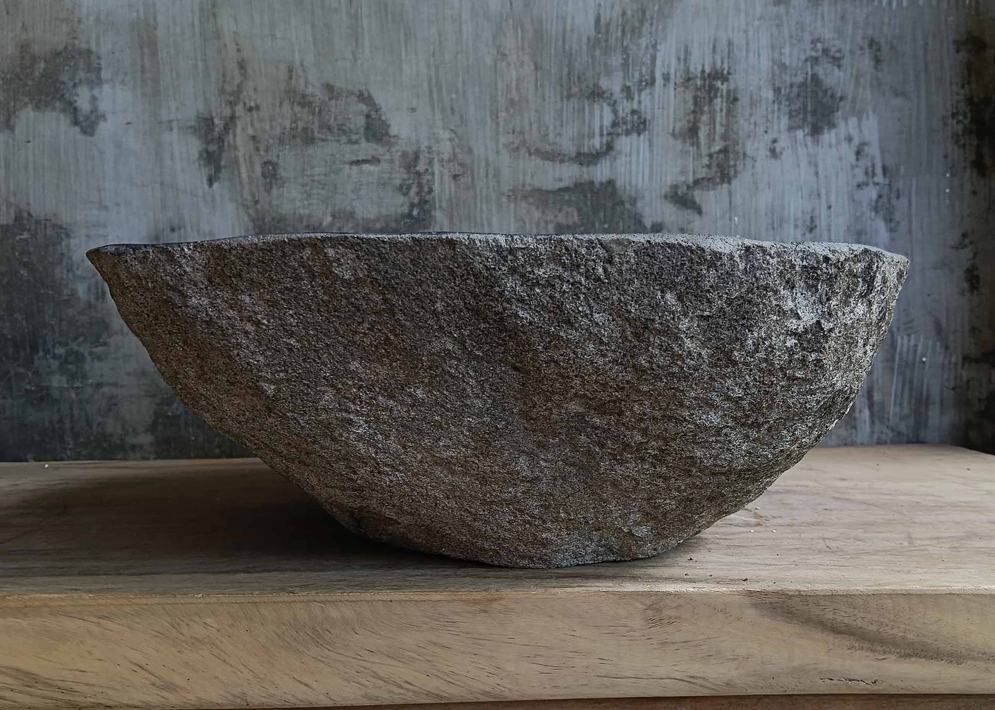Back view of handcrafted dark gray river stone sink 6676-5343 with textured stone surface