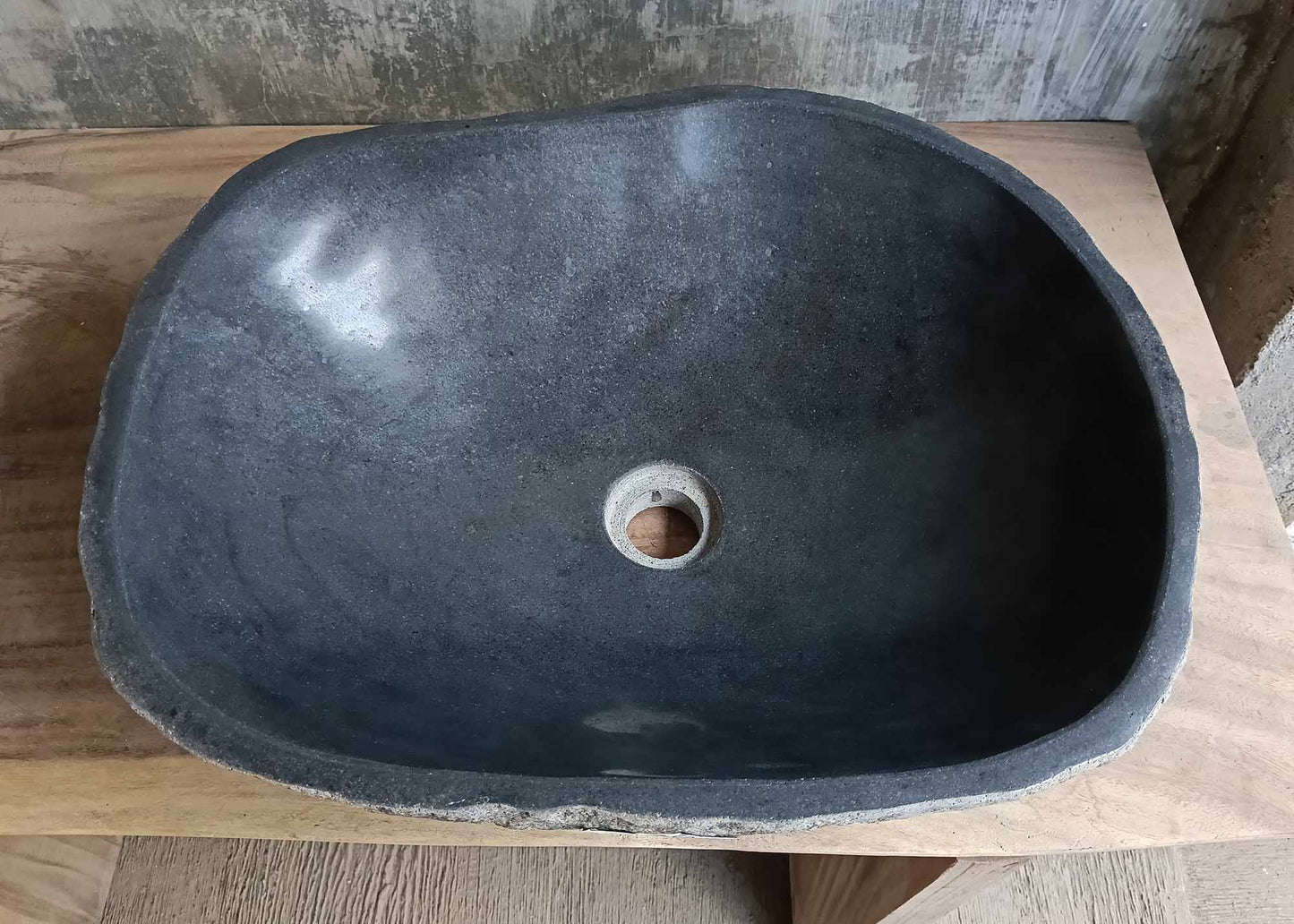 Top view of handcrafted dark gray river stone sink 6676-5343 with polished interior
