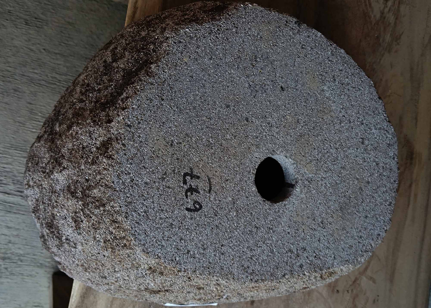 Bottom view of handcrafted dark gray river stone sink 6677-4335 showing raw stone base