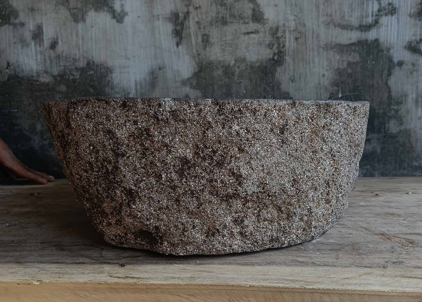 Back view of handcrafted dark gray river stone sink 6677-4335 with textured stone surface