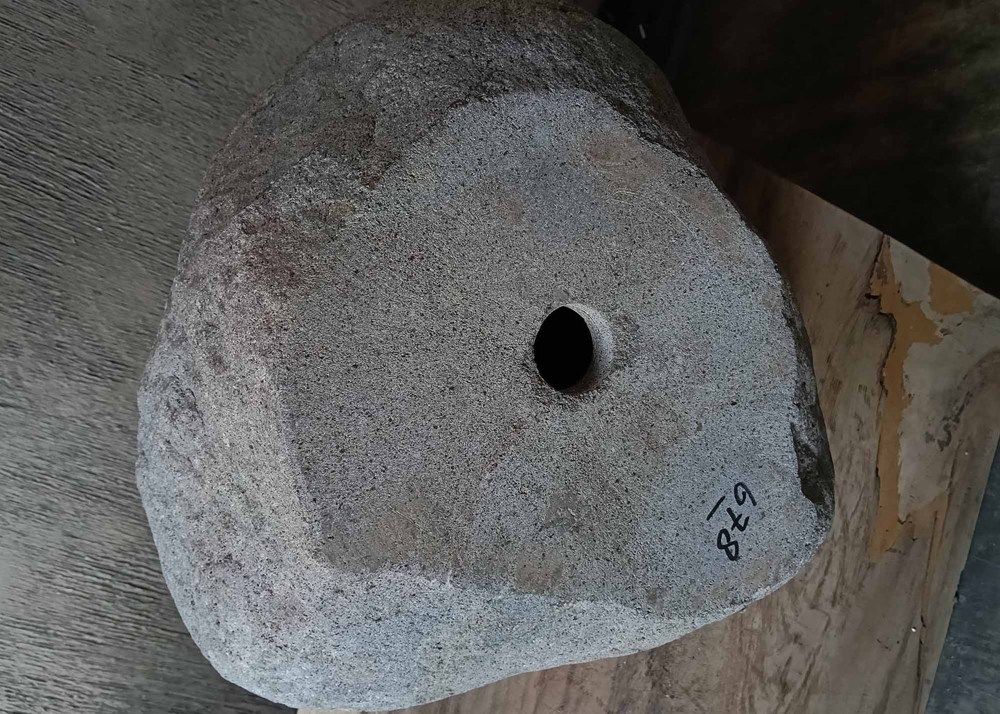 Bottom view of handcrafted dark gray river stone sink 6678-4337 showing raw stone base