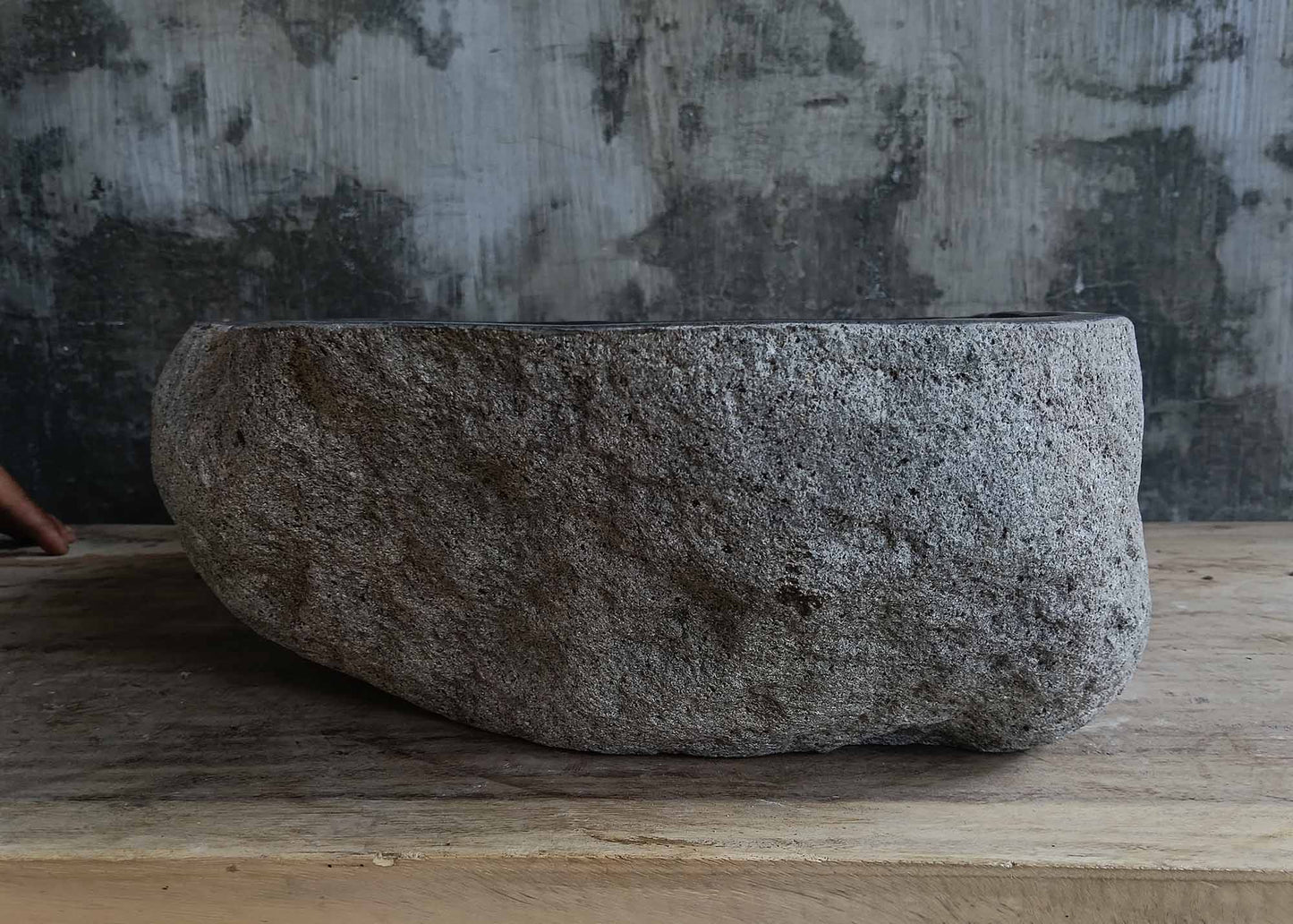 Left side view of handcrafted dark gray river stone sink 6678-4337 with organic shape
