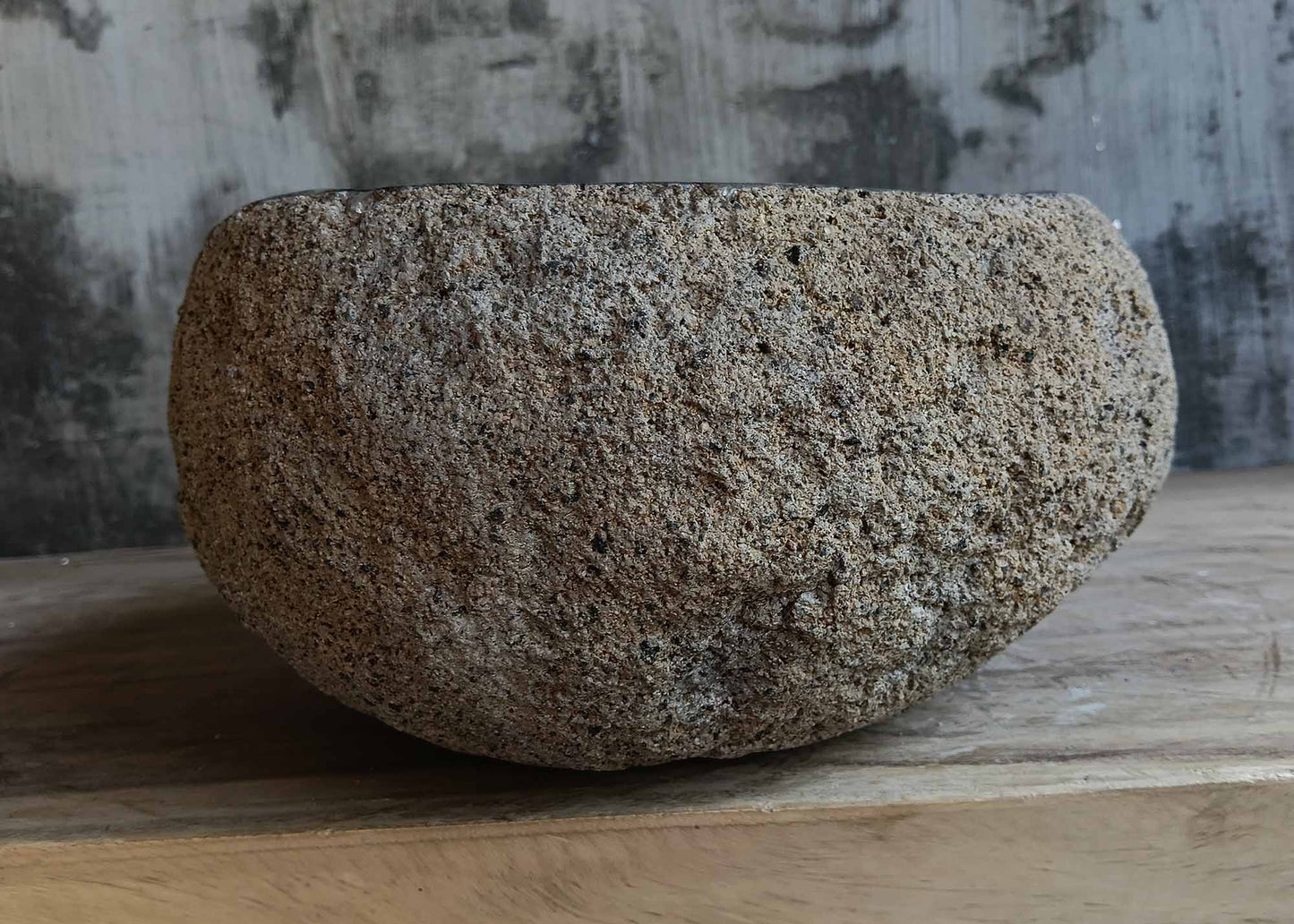 Right side view of handcrafted light brown river stone sink 6680-3731 with rustic stone texture