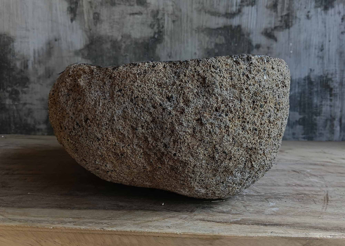 Left side view of handcrafted light brown river stone sink 6680-3731 with organic shape