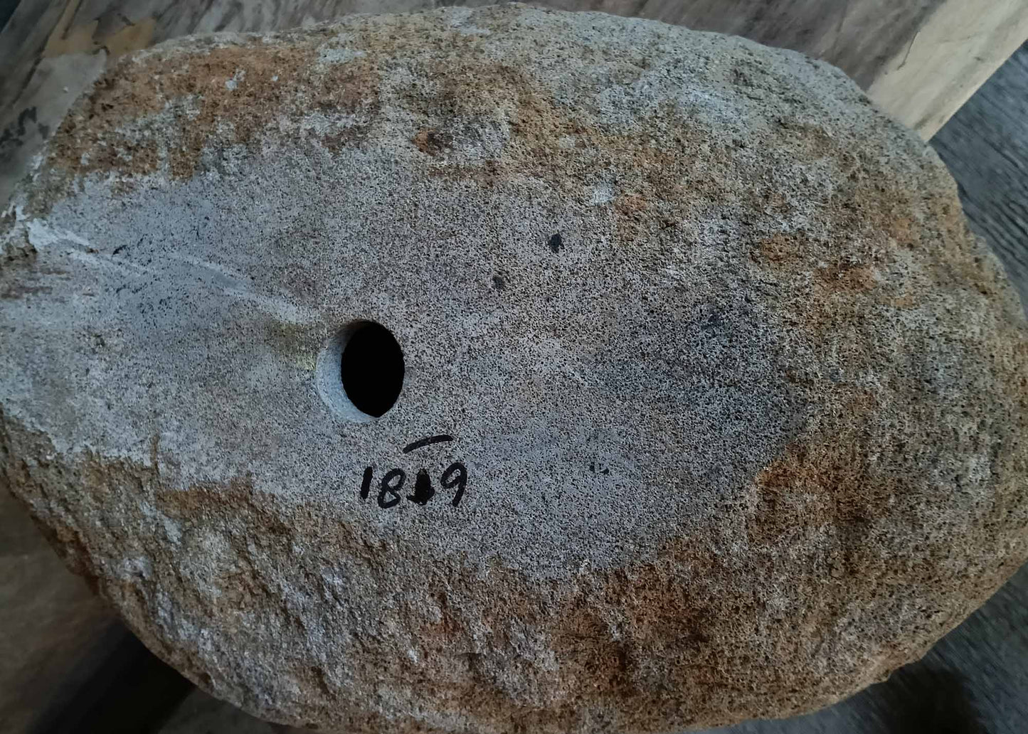 Bottom view of handcrafted brown-gray river stone sink 6681-5837 showing raw stone base