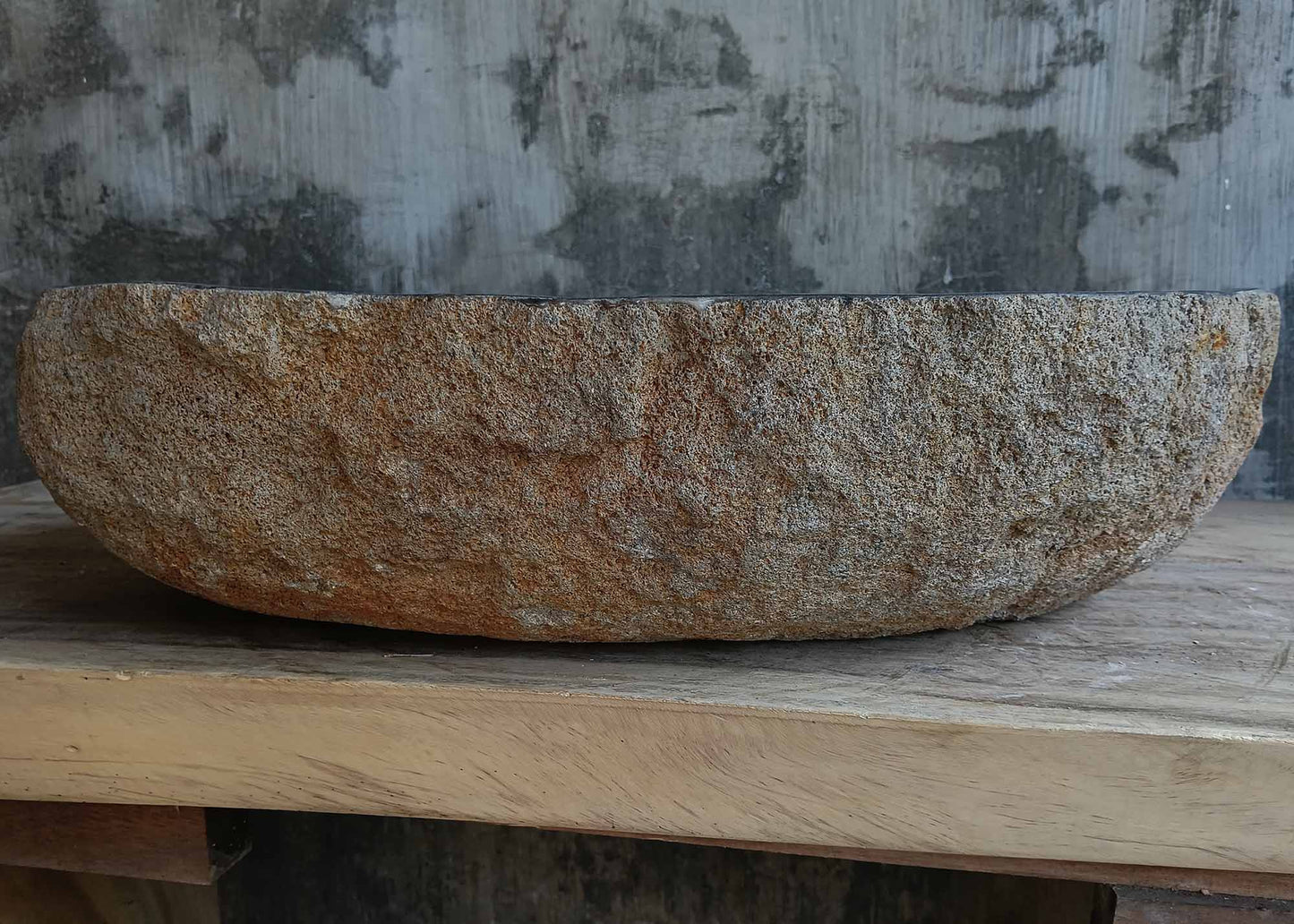 Back view of handcrafted brown-gray river stone sink 6681-5837 with textured stone surface