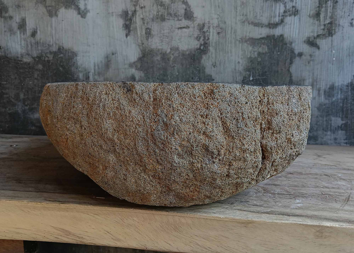 Left side view of handcrafted brown-gray river stone sink 6681-5837 with organic shape