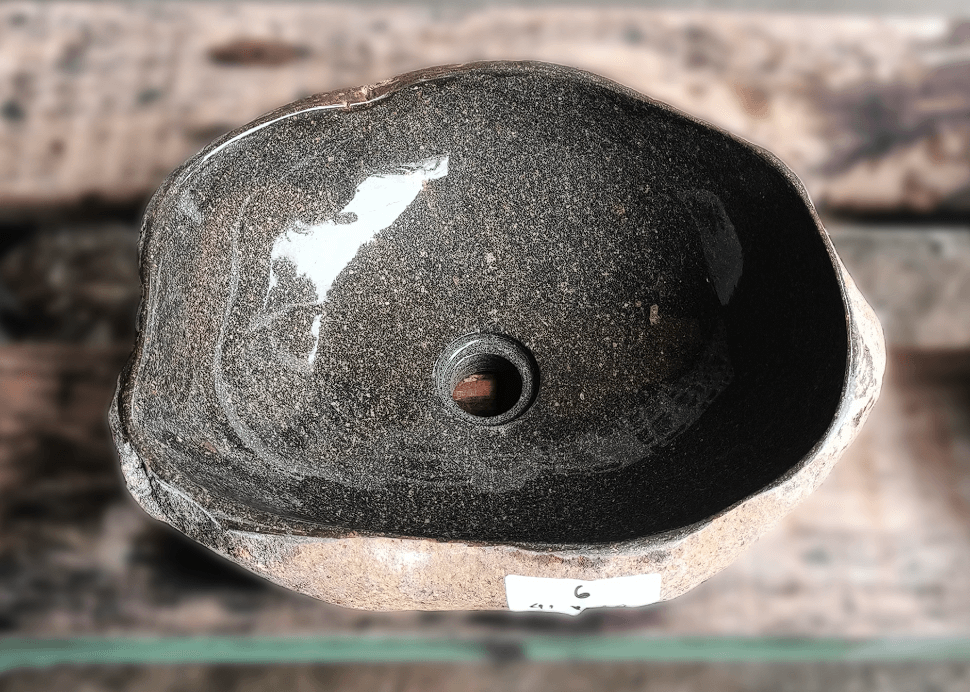 Top view of river stone sink 6006-4134 with dark polished interior and raw stone texture