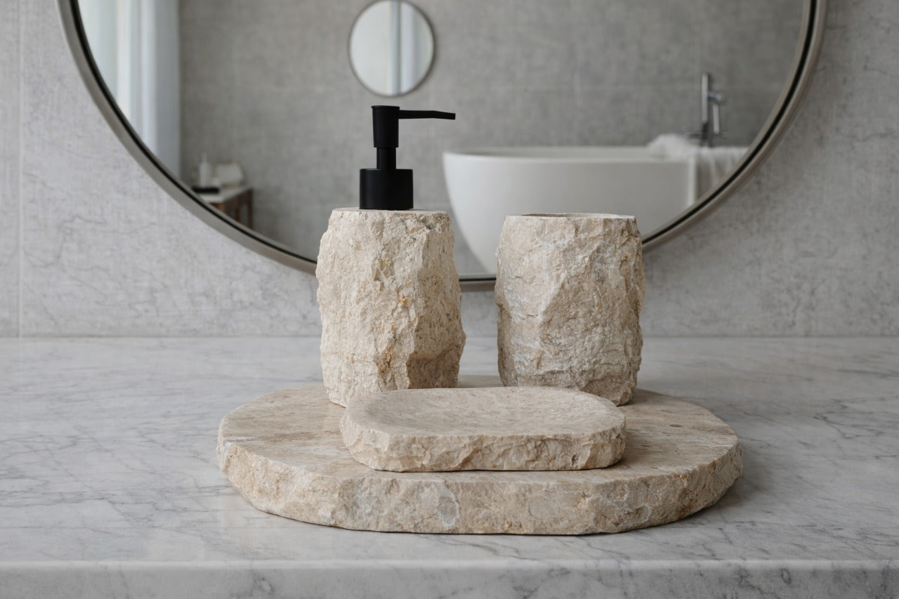 Beige marble bathroom accessories set made from natural light marble with rough stone texture