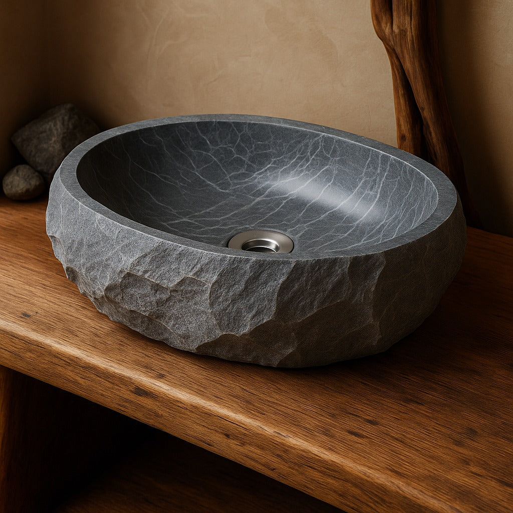 Collection of gray marble sinks made from natural stone for bathroom interiors
