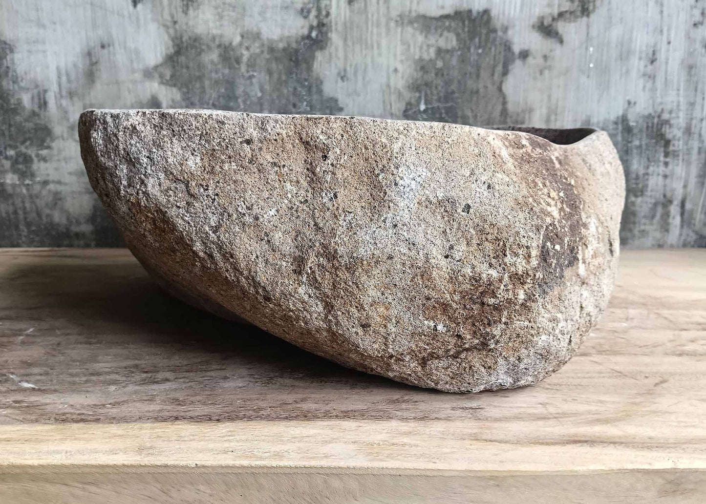 Right side of handcrafted river stone sink 6001-4535 with organic curves
