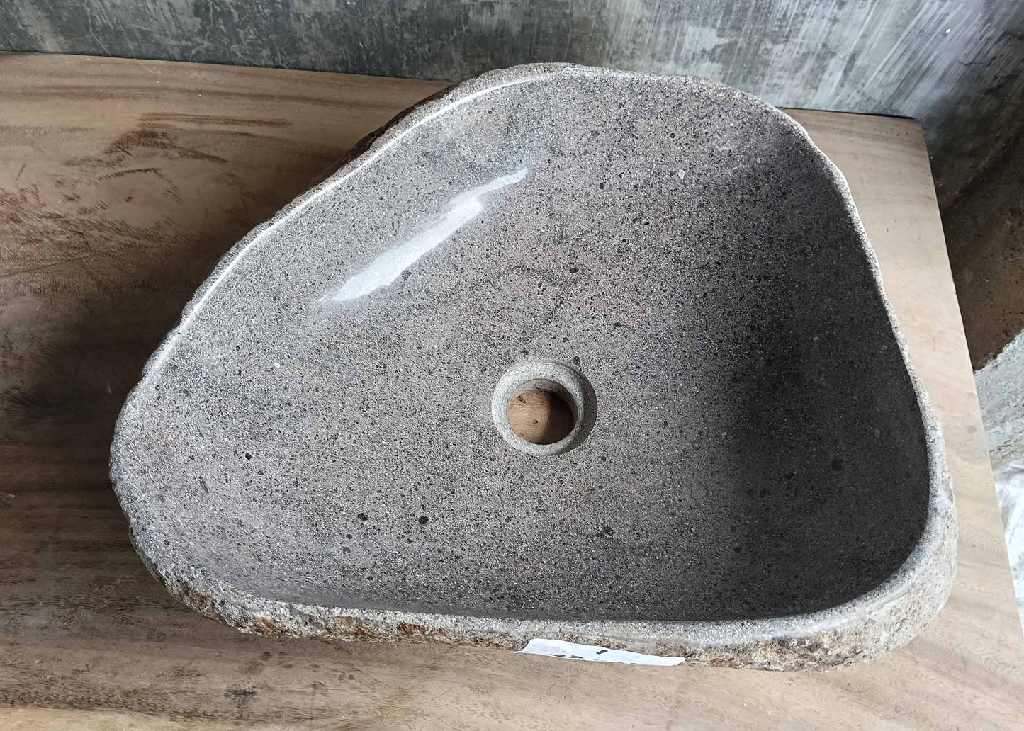 Top view of triangular river stone sink 6001-4535 with polished light gray interior
