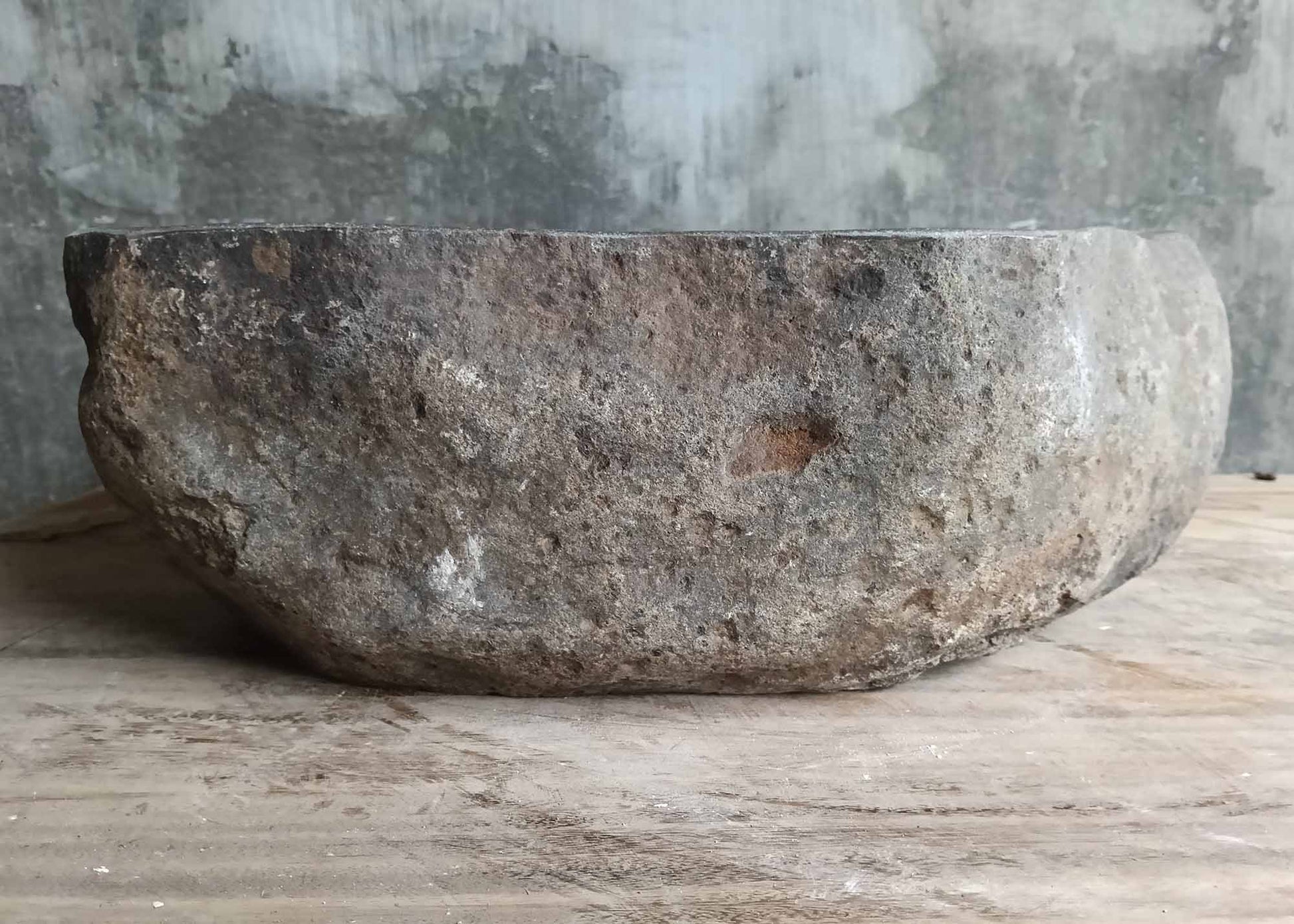 Left side angle of uniquely shaped sink 6004-4033 in dark gray stone
