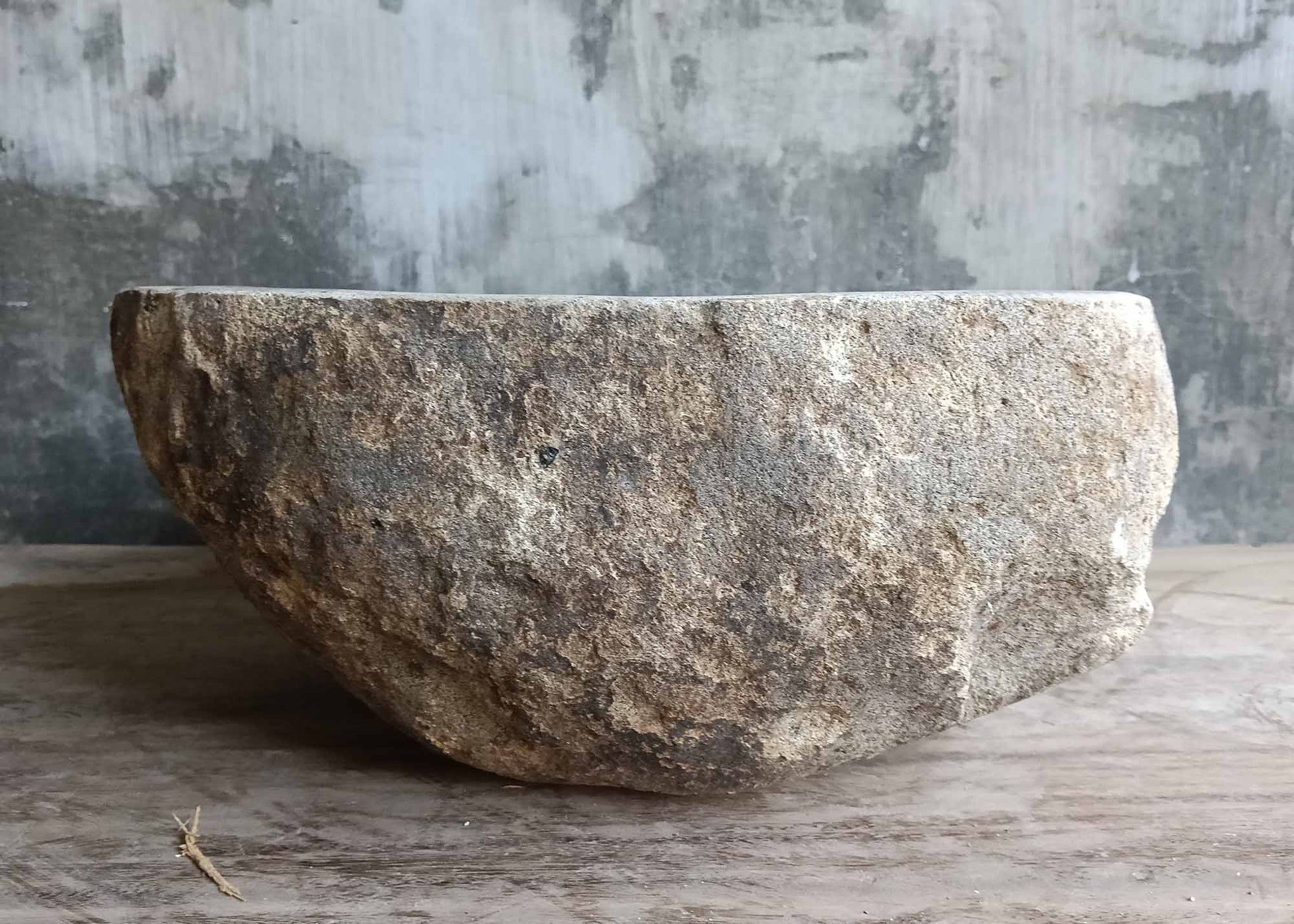 Back side of handcrafted triangular sink made from natural stone – 6005-3934
