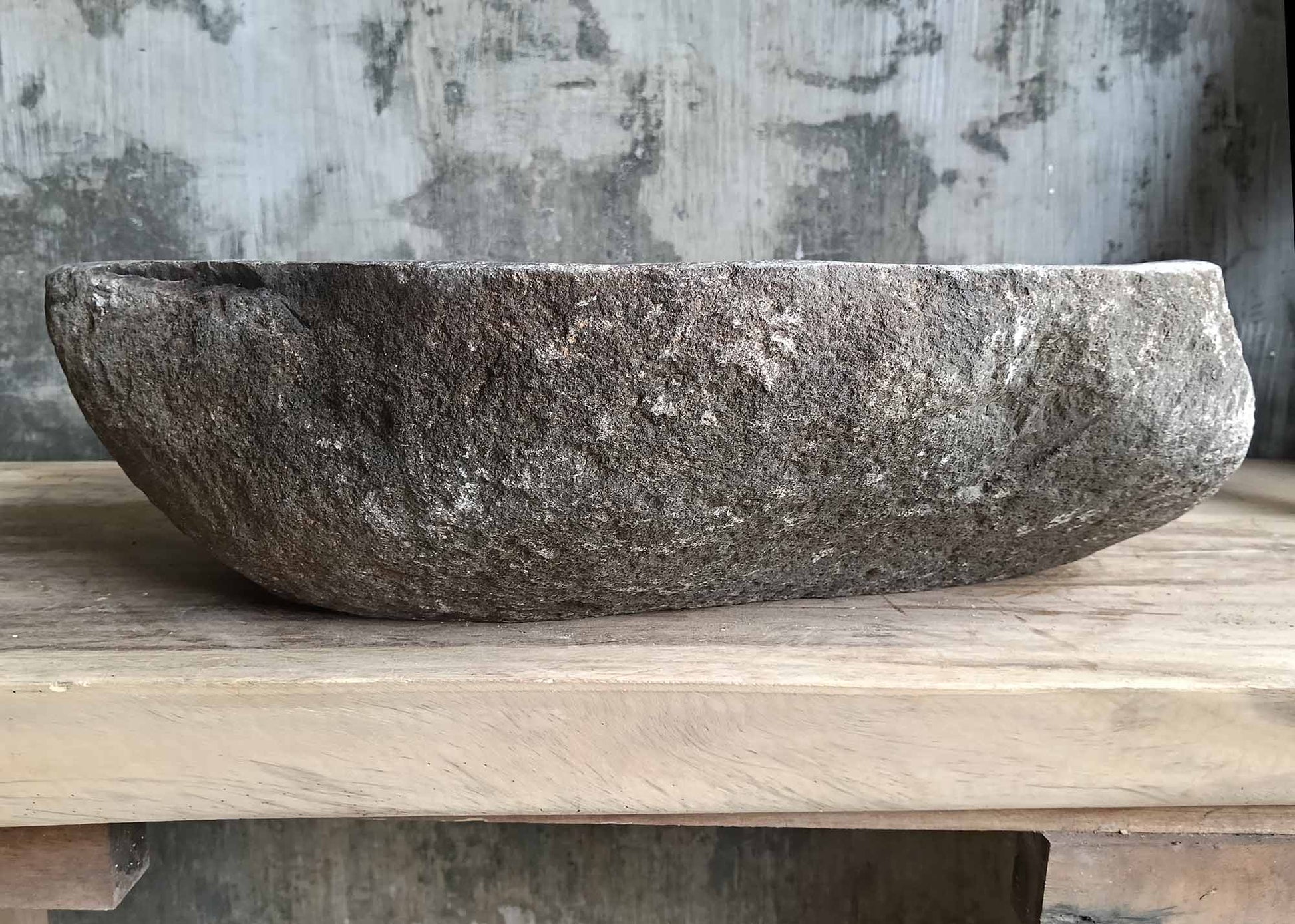 Rear view of river stone sink SKU 6007-5338 highlighting uneven natural stone texture and polished interior
