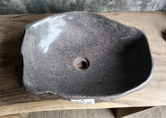 Top view of handcrafted river stone sink SKU 6007-5338 with polished dark interior and natural rough exterior texture
