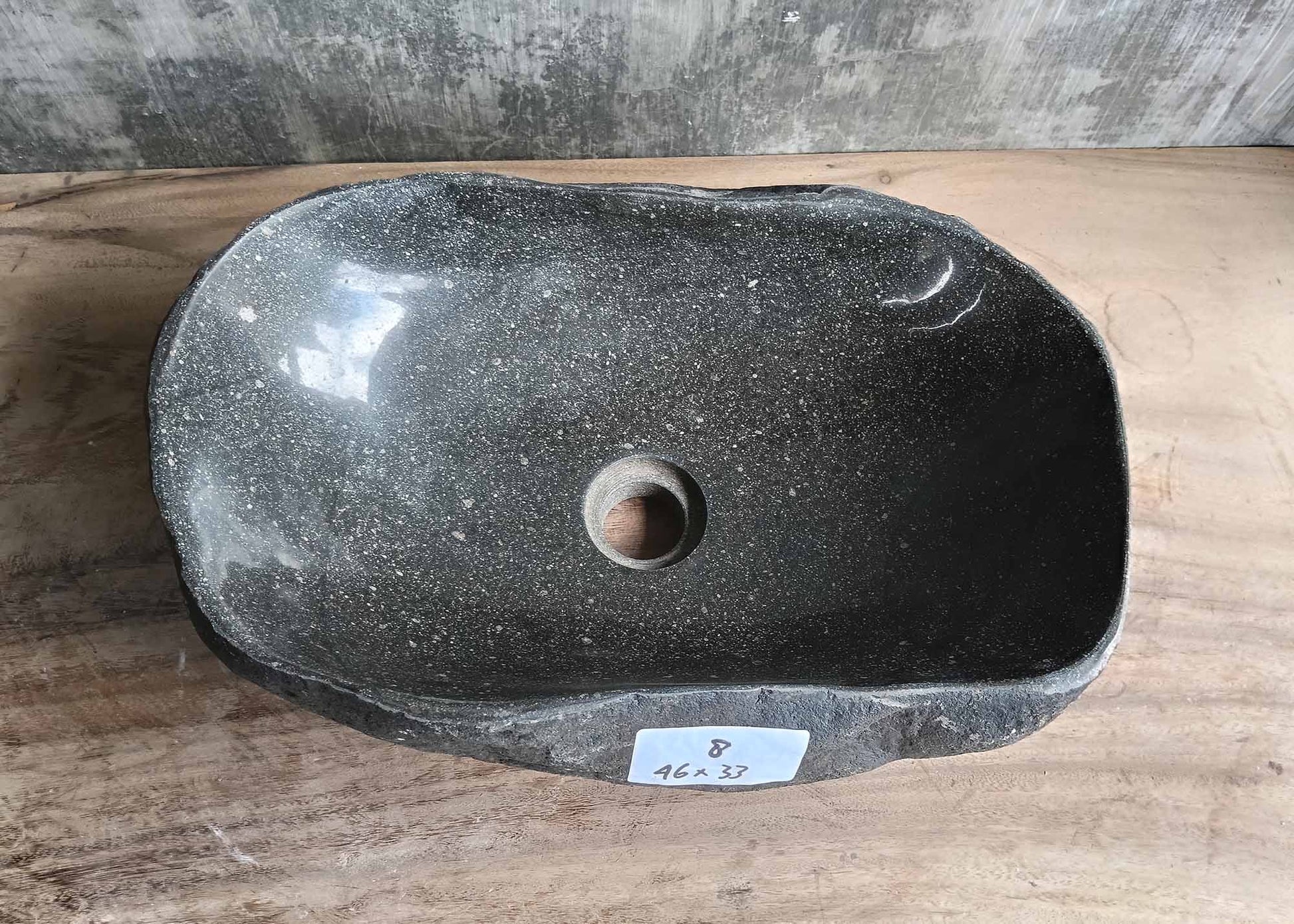 Top view of oval river stone sink 6008-4633 with dark gray polished interior
