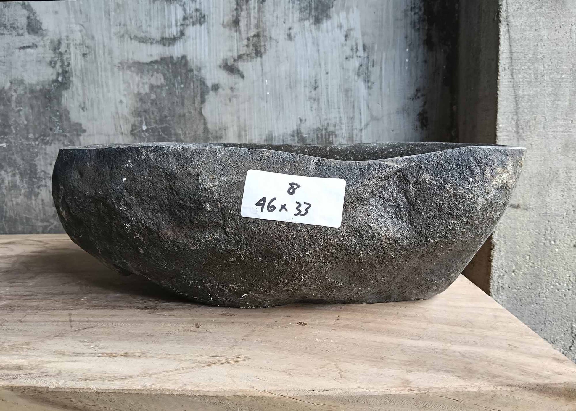 Front view of handcrafted river stone sink 6008-4633 with smooth glossy surface
