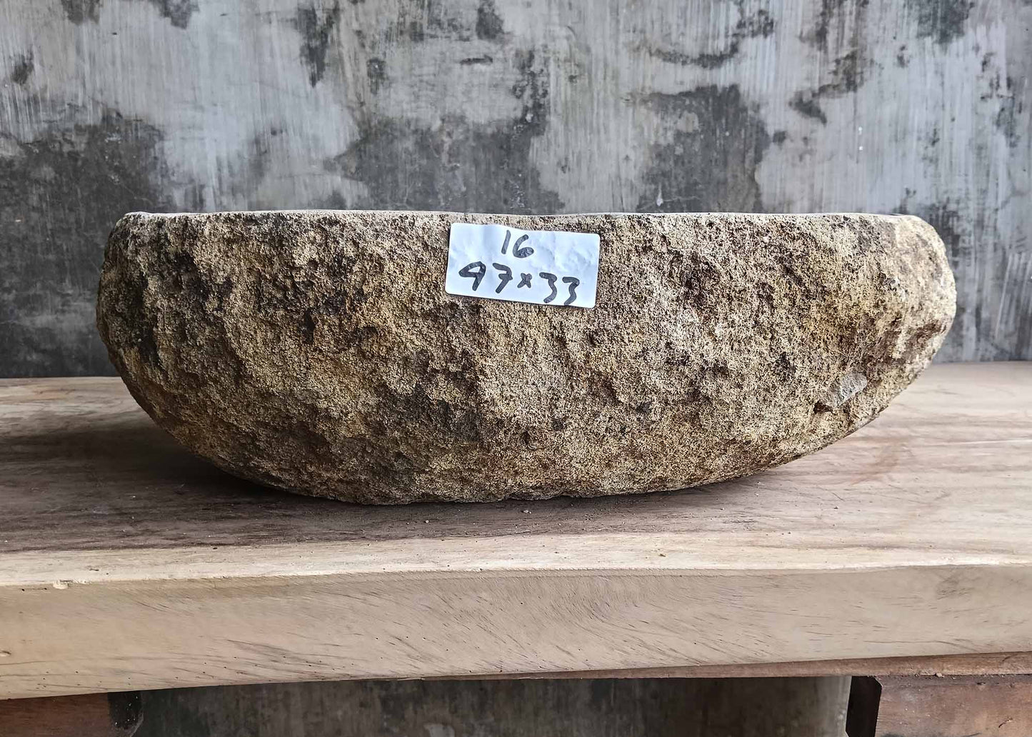 Front view of handcrafted river stone sink 6016-4733 showing rough outer texture
