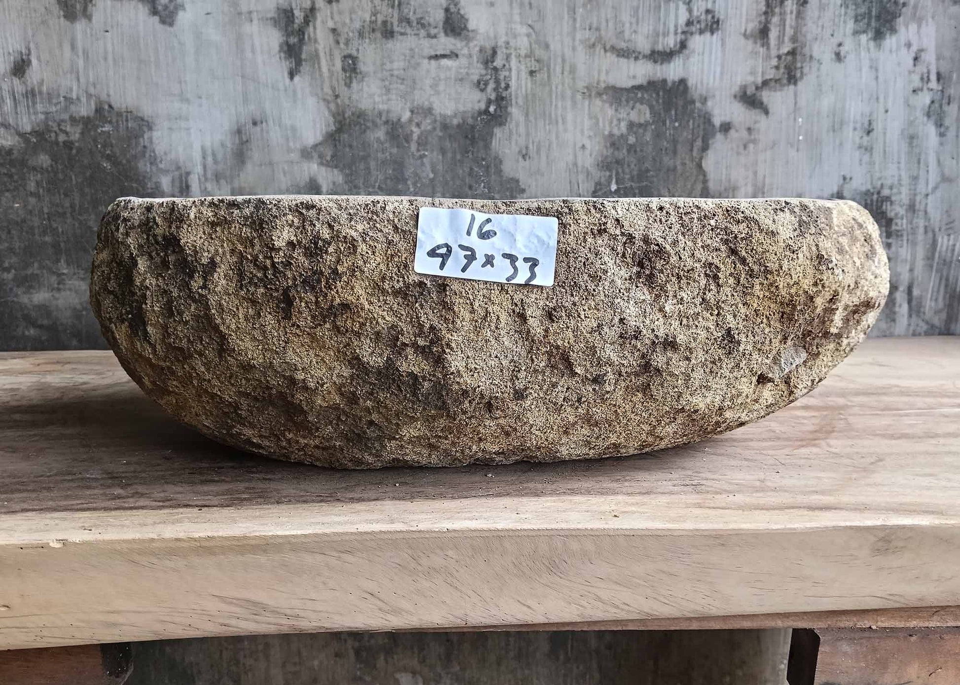 Front view of handcrafted river stone sink 6016-4733 showing rough outer texture
