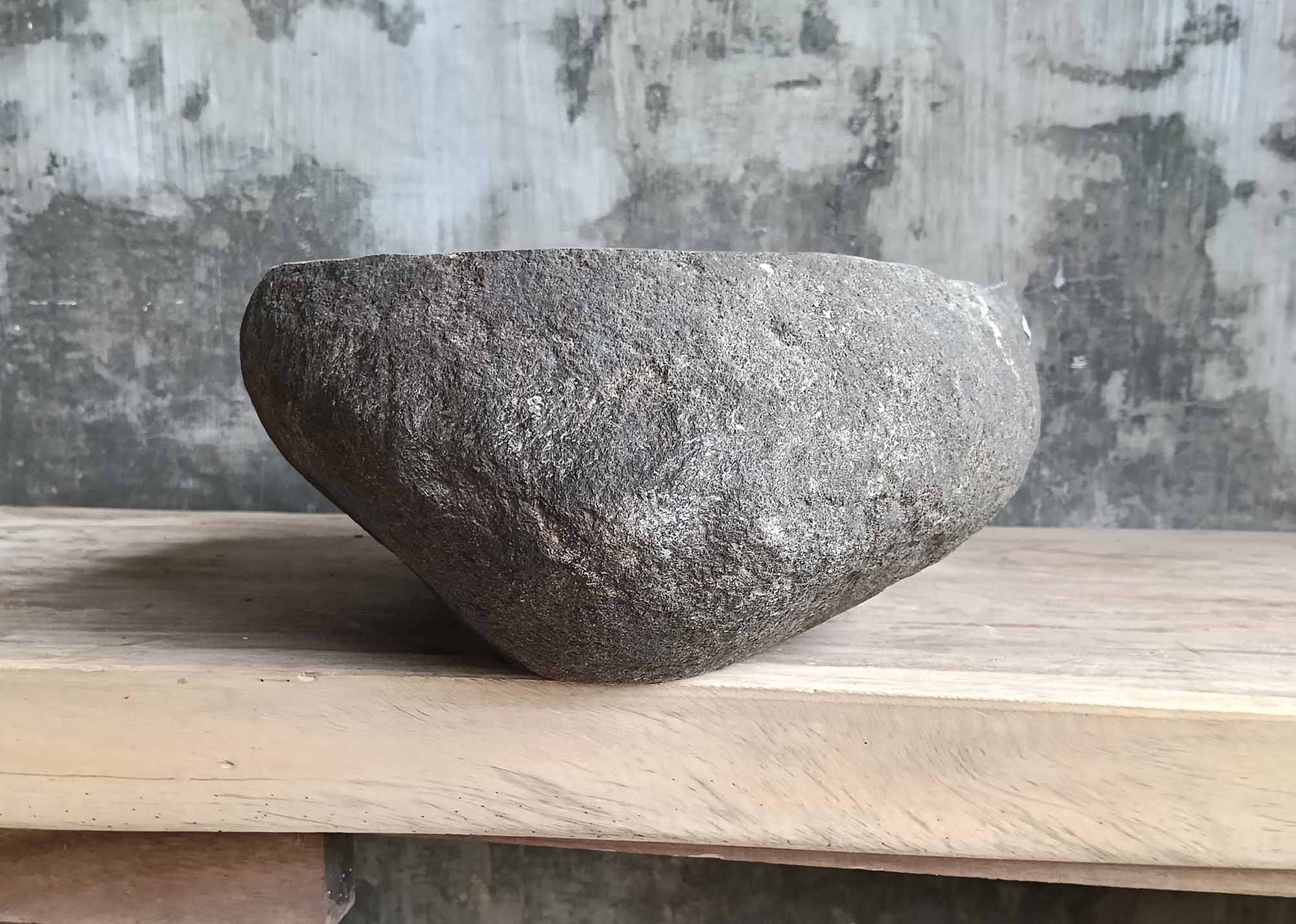 Backside of river stone sink 6018-4732 with rugged gray stone texture
