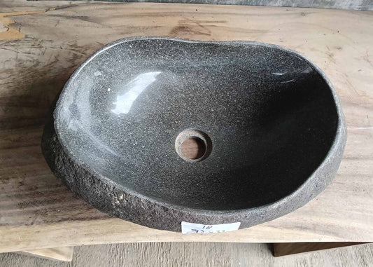 Top view of oval river stone sink 6018-4732 with dark gray polished interior
