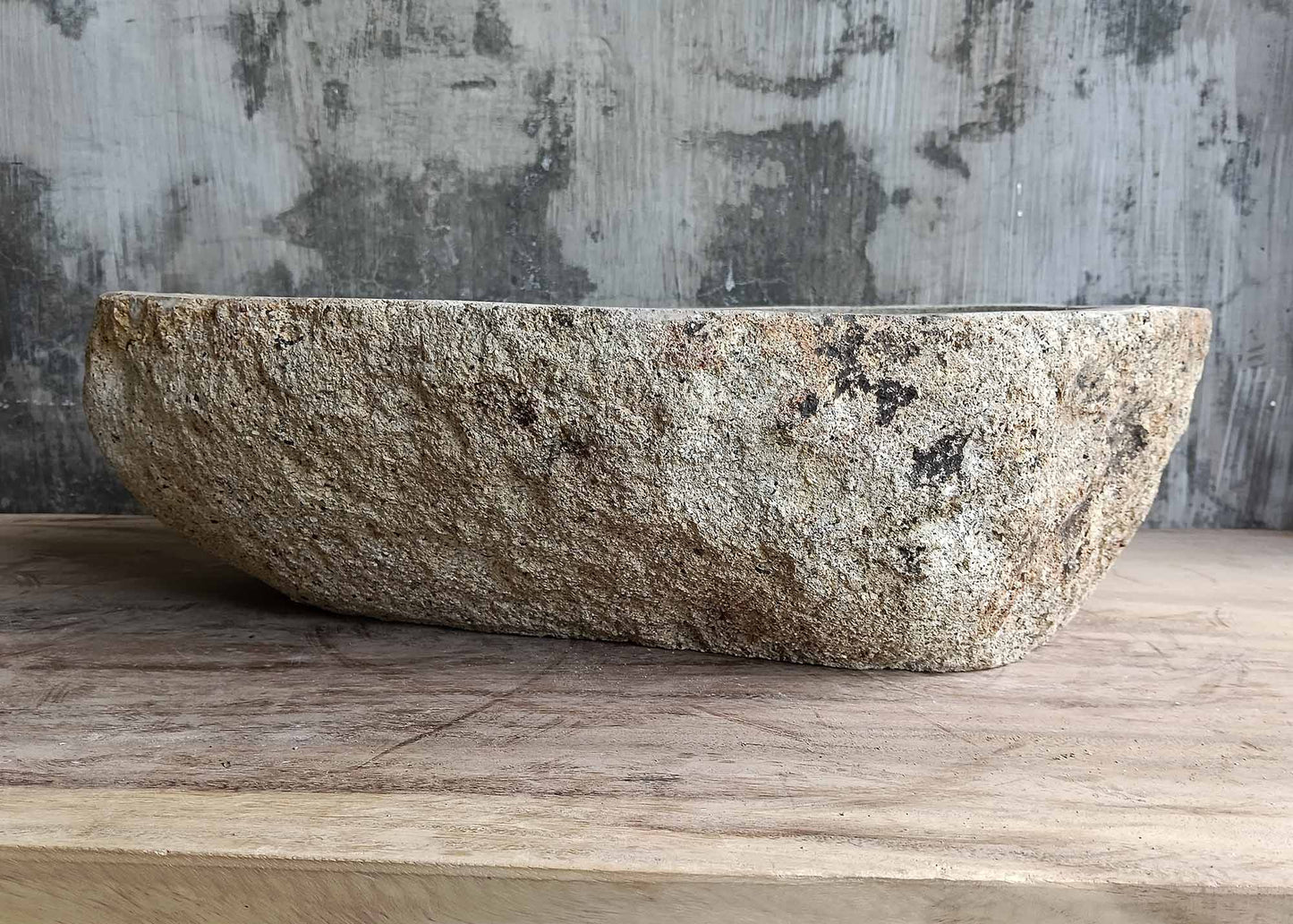 Rear view of oval river stone sink SKU 6026-5435 highlighting organic natural stone texture and polished interior surface
