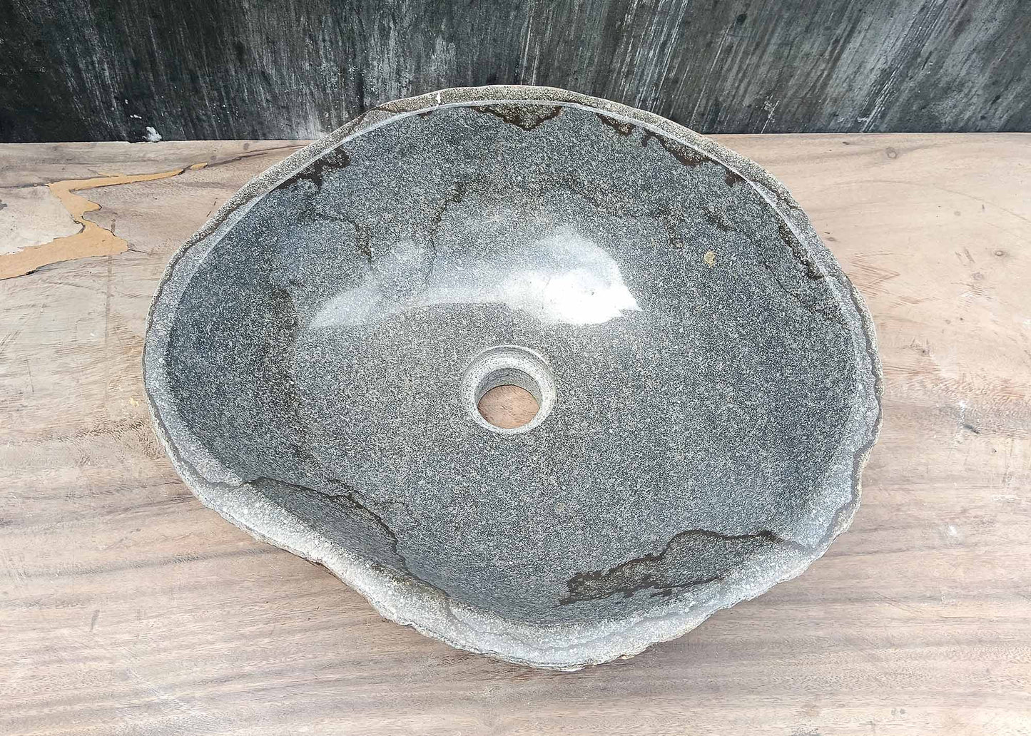 Top view of irregular river stone sink 6036-4237 with polished gray interior and dark natural veins
