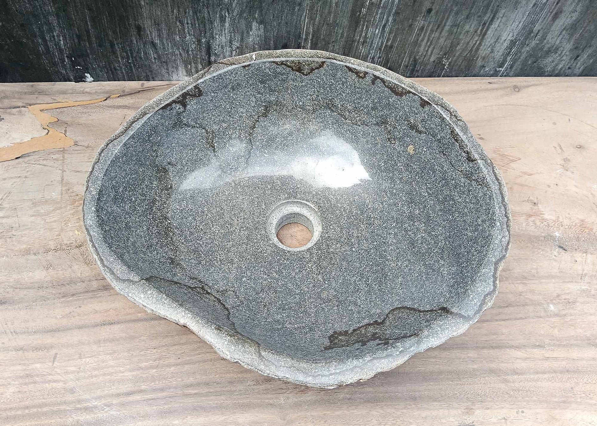 Top view of irregular river stone sink 6036-4237 with polished gray interior and dark natural veins
