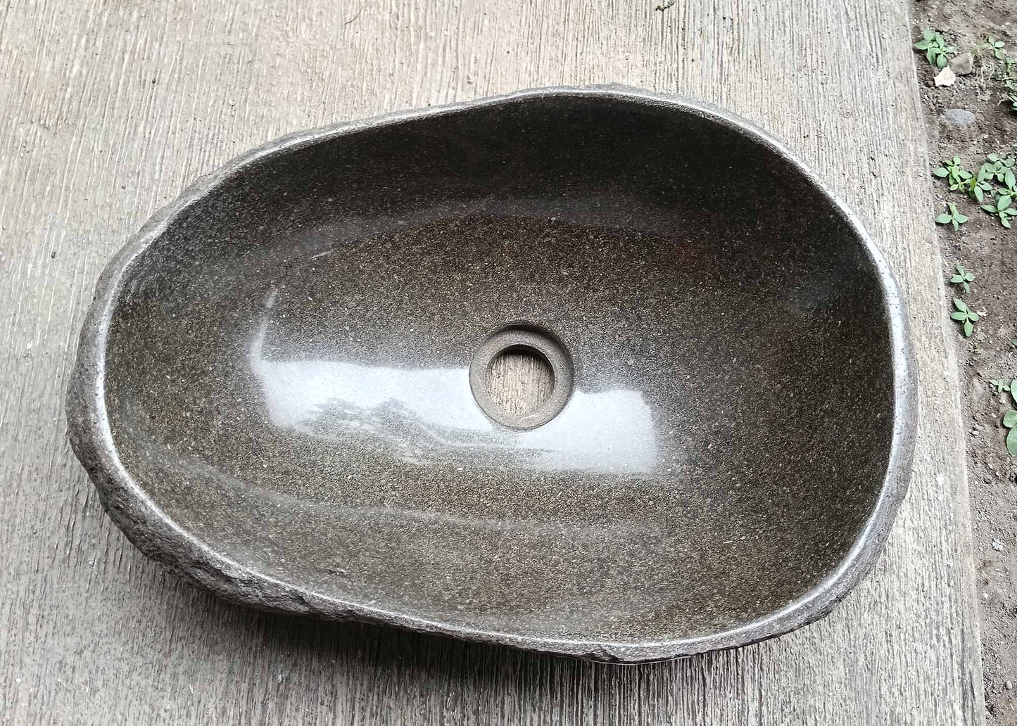 Top view of oval river stone sink 6039-4732 with dark brown polished interior
