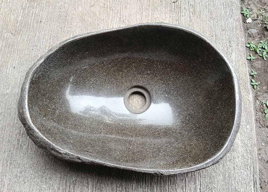 Top view of oval river stone sink 6039-4732 with dark brown polished interior
