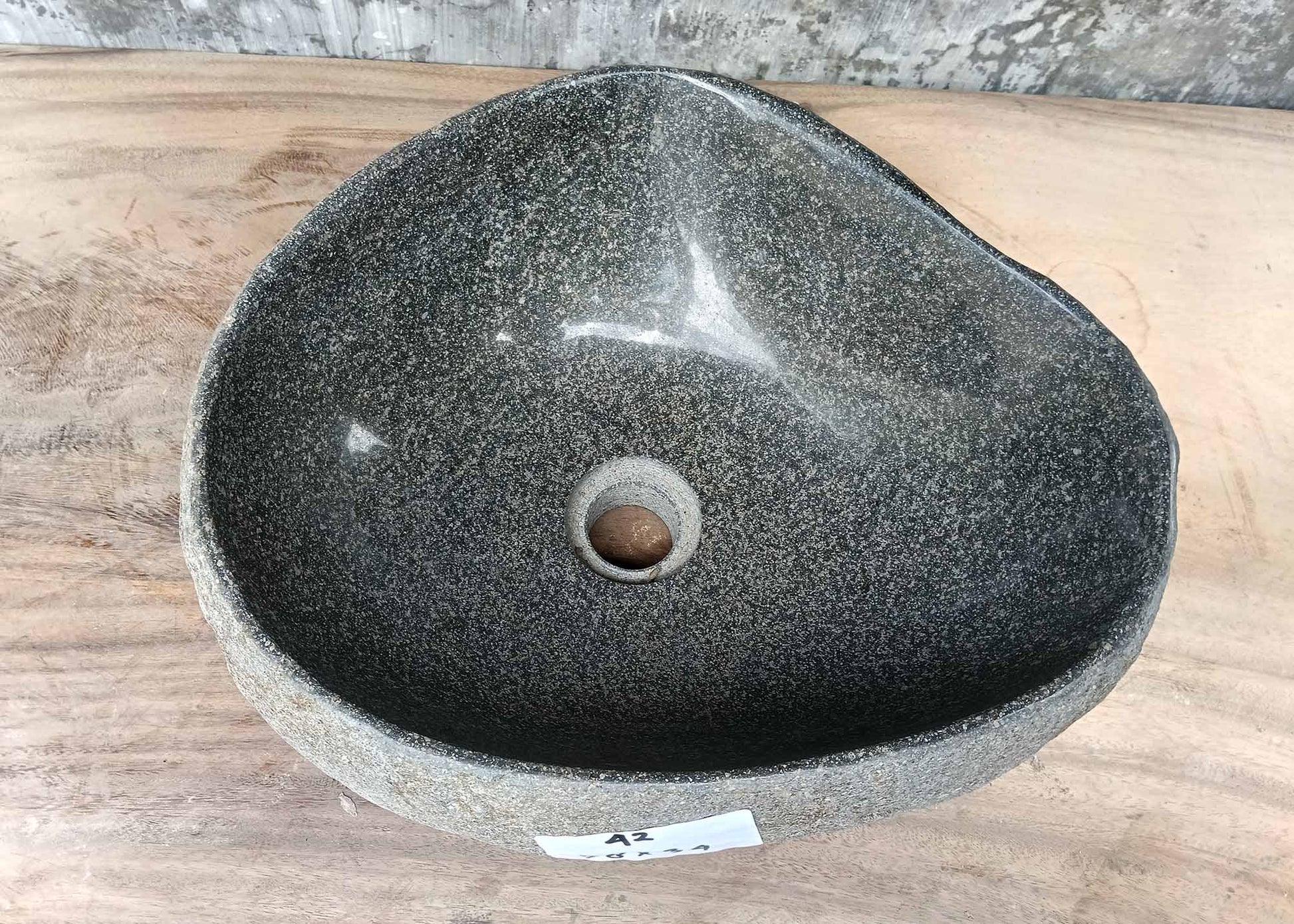 Top view of triangular river stone sink 6042-3834 with light gray polished interior

