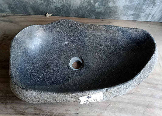 Top view of handcrafted oval river stone sink SKU 6046-5534 with polished dark interior and natural textured stone exterior
