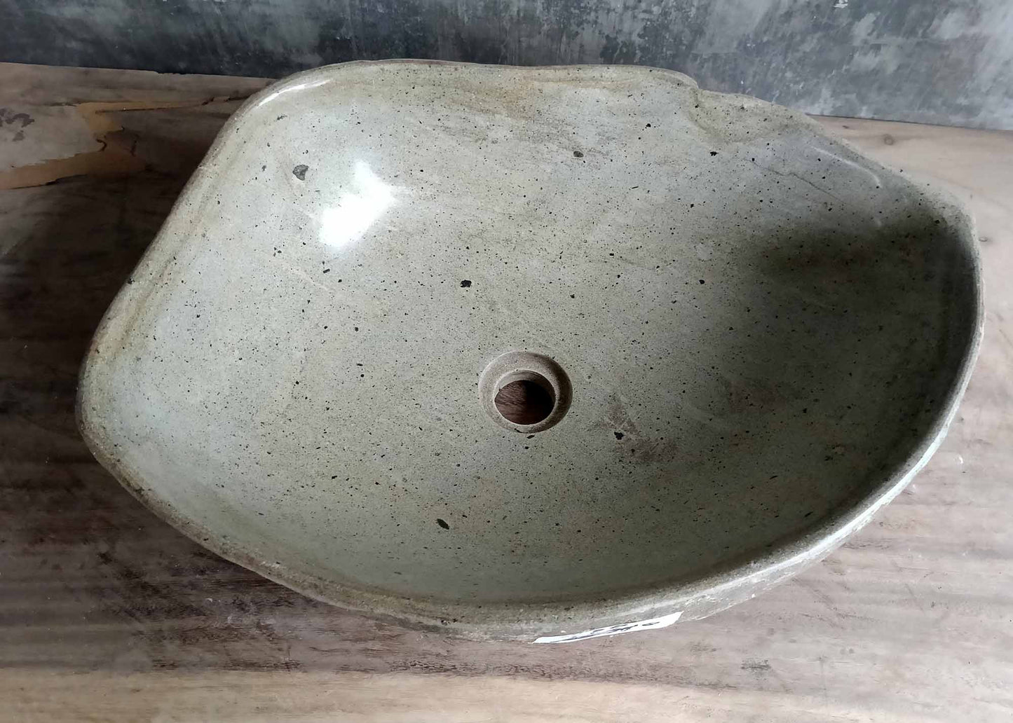 Top view of handcrafted oval river stone sink SKU 6050-5338 with polished light interior and natural textured exterior
