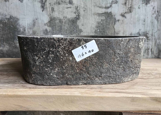 Front view of handcrafted stone sink 6055-4640 with smooth glossy interior and rough edge
