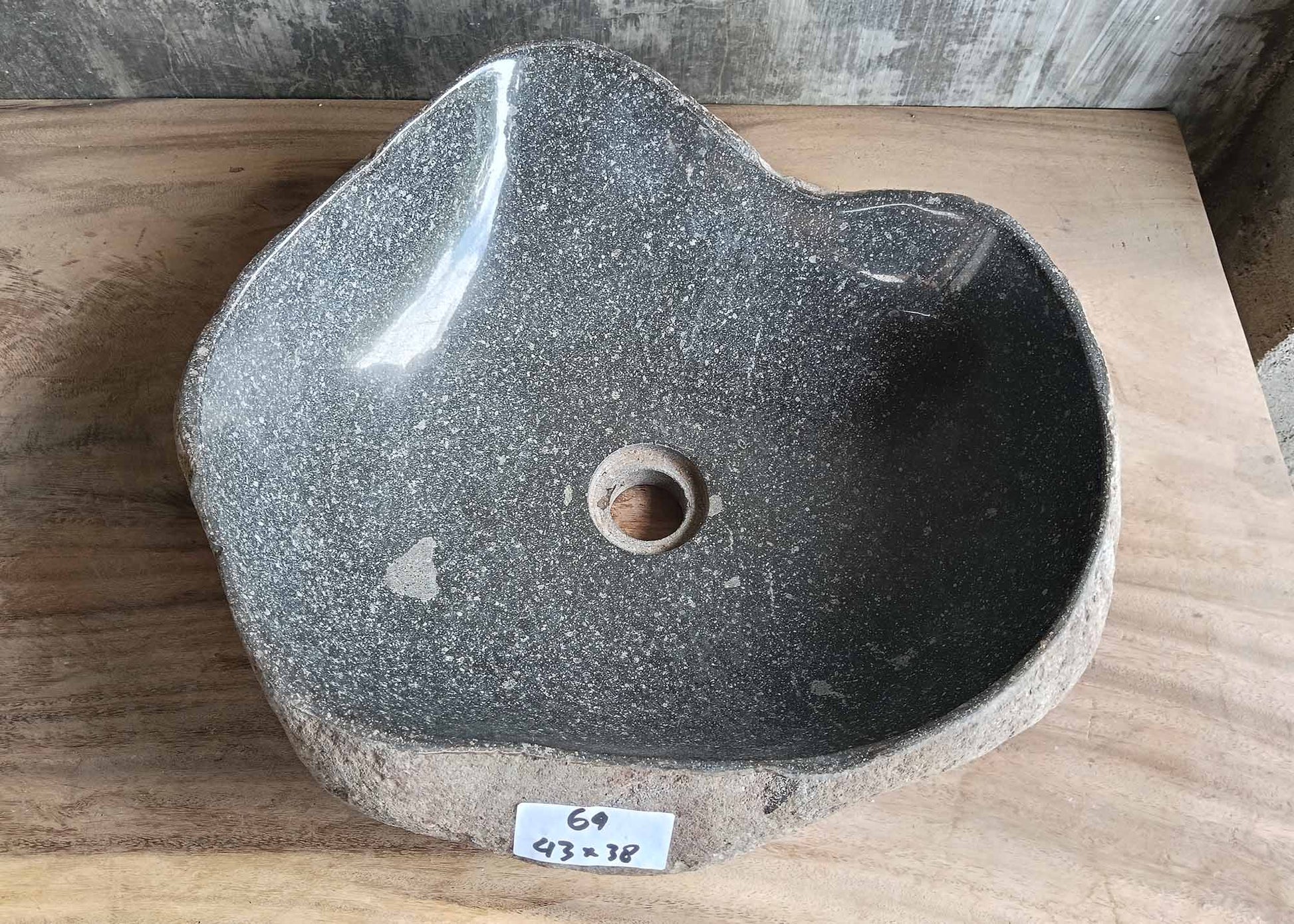 Top view of triangular river stone sink 6064-4338 with polished gray interior
